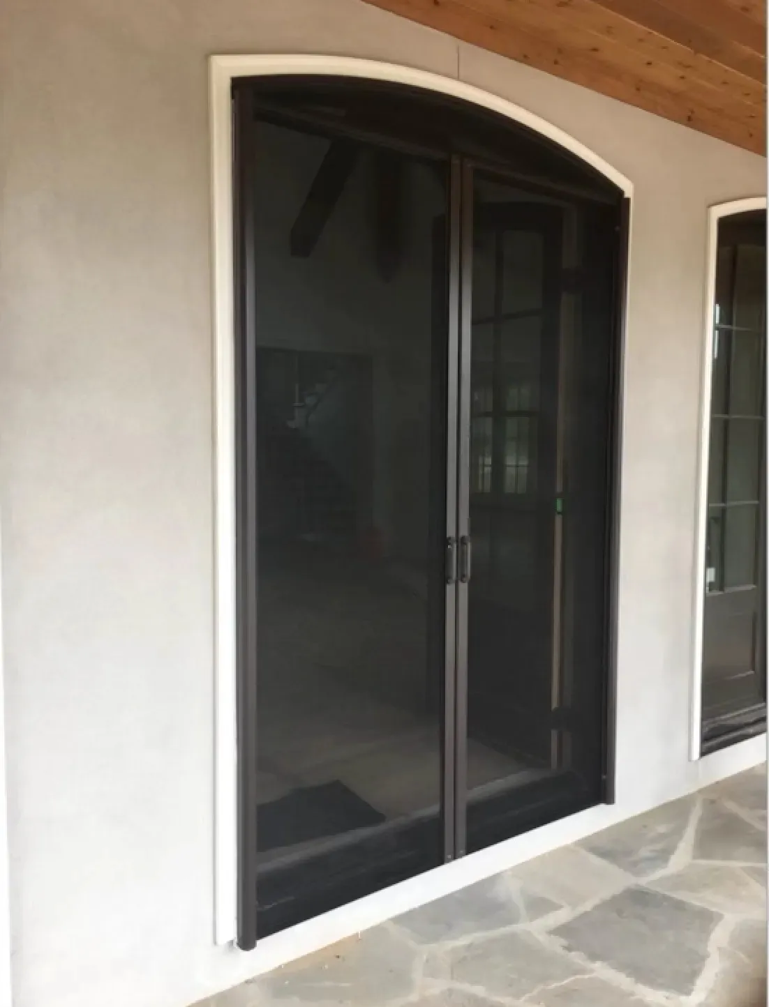 Custom retractable screen installed on a residential doorway